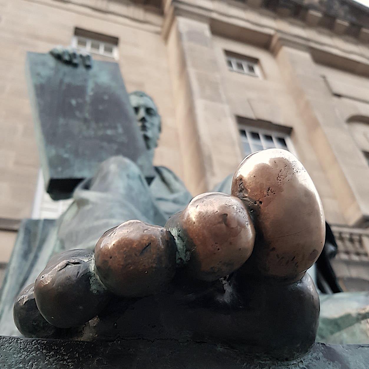its common tradition to rub the toe of hume's statue on edinburgh's royal mile for good luck