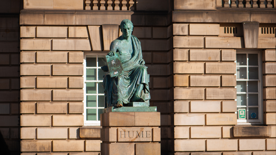 A statue of David Hume in Edinburgh, dressed like a Greek philosopher and with one toe rubbed to shiny brass.
