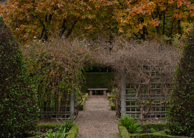 An archway in Dunbar's Close Garden showing a bench in the background