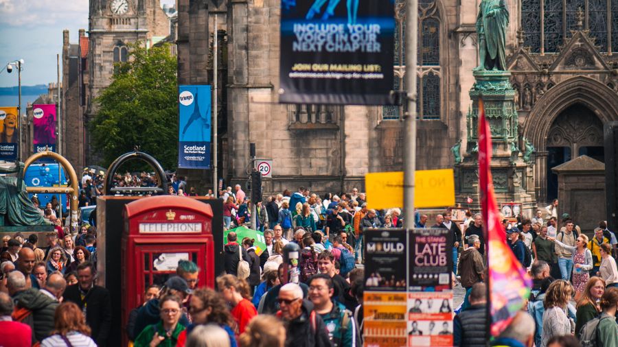 The Edinburgh Royal Mile turned into a huge crowd of people as Edinburgh Fringe Festival poster decorate lampposts.