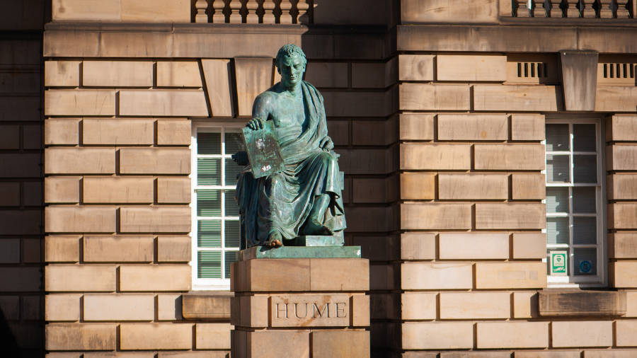 A statue of David Hume in Edinburgh, dressed like a Greek philosopher and with one toe rubbed to shiny brass.