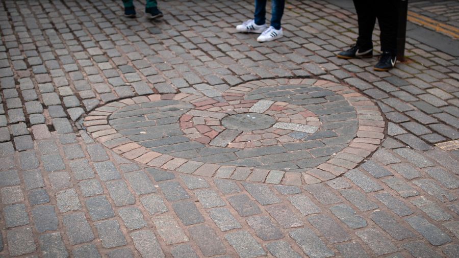 A stone mosaic depicting a heart inlaid in the cobblestones of the Royal Mile in Edinburgh.