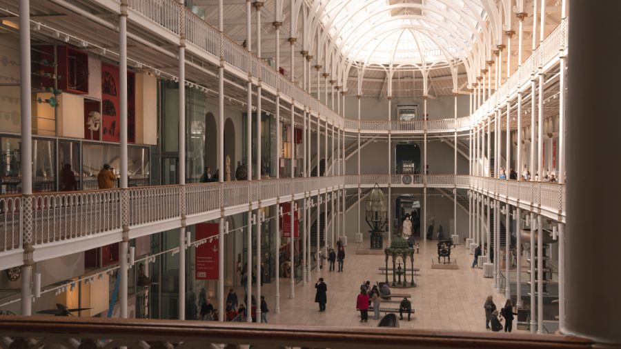 The grand gallery of the National Museum of Scotland on a sunny day.